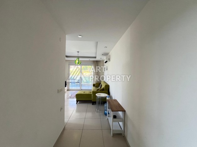 Просторная квартира 1+1 в 300 метрах от моря в районе Кестель, 65 кв.м. - Ракурс 9