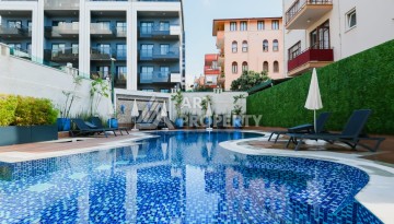 Квартира 1+1 для привилегированной жизни в центре Алании, 250 м от моря - Ракурс 1