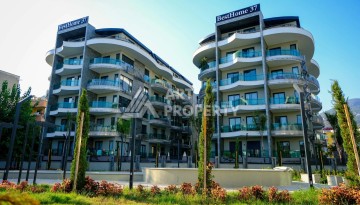 Квартира 1+1 в одном из самых люксовых проектов Алании, всего в 50 метрах от моря - Ракурс 1