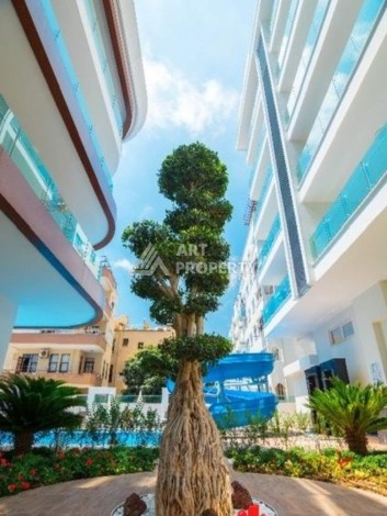 Квартира 1+1 в центре Алании в элитной резиденции, 60 кв.м. - Ракурс 1