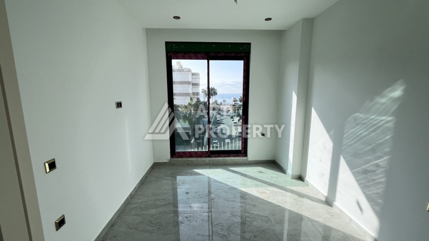 Квартира 1+1 в престижной резиденции Тосмура в 150 метрах от моря - Ракурс 12