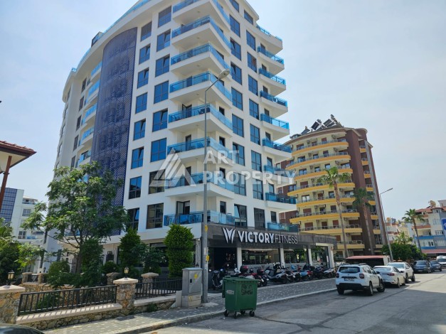 Квартира 1+1 в престижном жилом комплексе в центре Алании, 60 кв.м. - Ракурс 2