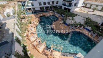 Современная квартира 1+1 в новой резиденции, центр Махмутлара, 55 кв.м. - Ракурс 1