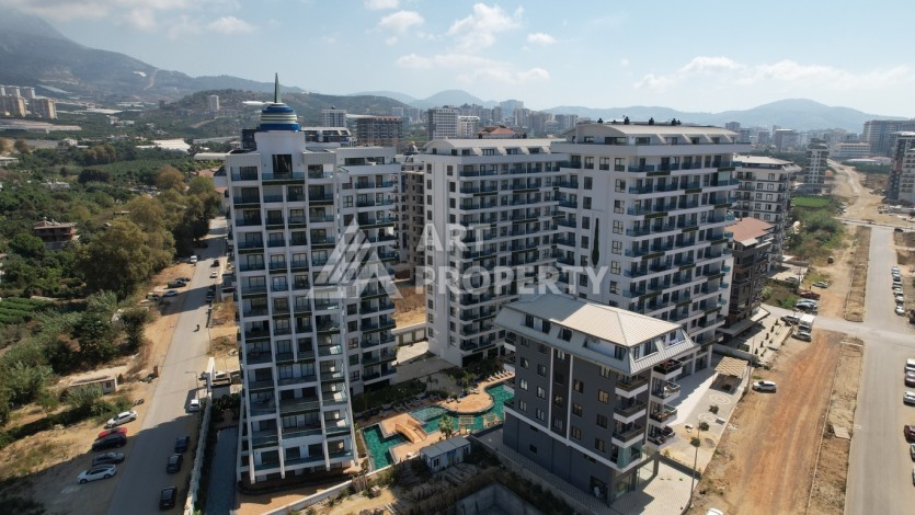 Современная квартира 1+1 в новой резиденции, центр Махмутлара, 55 кв.м. - Ракурс 2