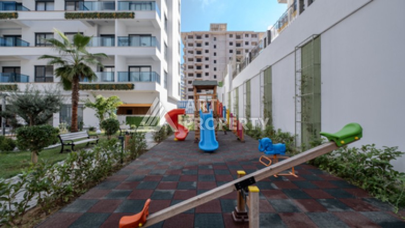 Современная квартира 1+1 в новой резиденции, центр Махмутлара, 55 кв.м. - Ракурс 7