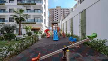 Меблированная квартира 1+1 в престижном комплексе в центре Махмутлара, 45 кв.м. - Ракурс 5