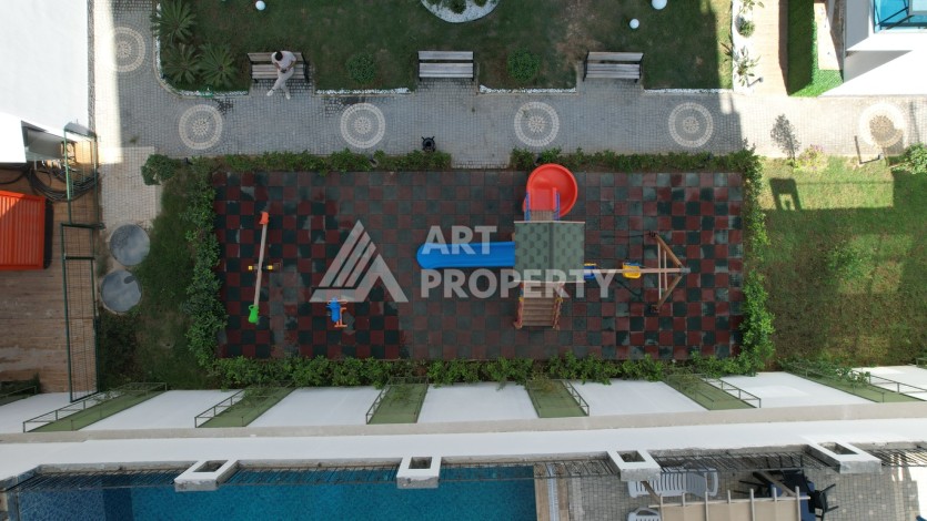 Меблированная квартира 1+1 в престижном комплексе в центре Махмутлара, 45 кв.м. - Ракурс 6