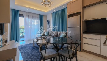 Меблированная квартира 1+1 в престижном комплексе в центре Махмутлара, 45 кв.м. - Ракурс 9