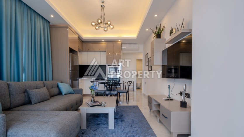 Меблированная квартира 1+1 в престижном комплексе в центре Махмутлара, 45 кв.м. - Ракурс 10