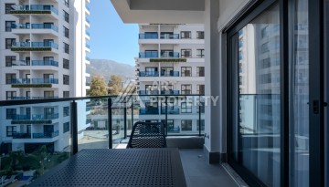 Меблированная квартира 1+1 в престижном комплексе в центре Махмутлара, 45 кв.м. - Ракурс 14