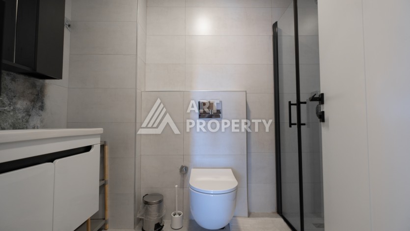 Меблированная квартира 1+1 в престижном комплексе в центре Махмутлара, 45 кв.м. - Ракурс 17