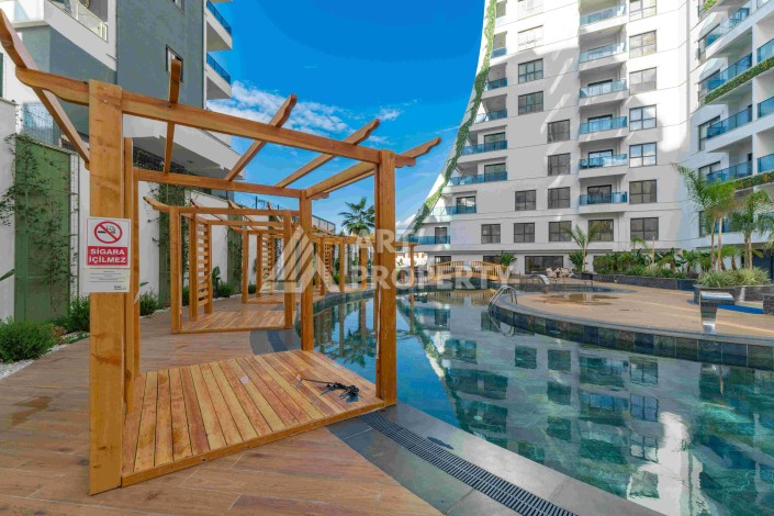 Элитная недвижимость в Махмутларе. Две квартиры 1+1 площадью 55 кв.м. - Ракурс 5