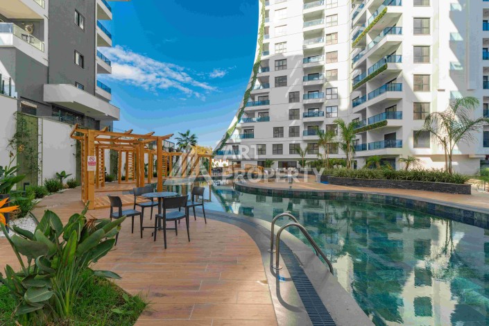 Элитная недвижимость в Махмутларе. Две квартиры 1+1 площадью 55 кв.м. - Ракурс 12