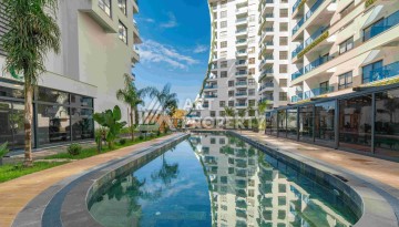 Элитная недвижимость в Махмутларе. Две квартиры 1+1 площадью 55 кв.м. - Ракурс 18