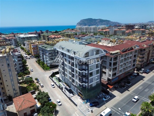 Квартира 1+1 с панорамным остеклением и открытыми видами на город, в комплексе 2024 года - Ракурс 1