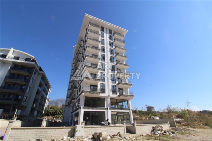 Две квартиры 1+1 в новом жилом комплексе Махмутлара, 47 кв.м. - Ракурс 2