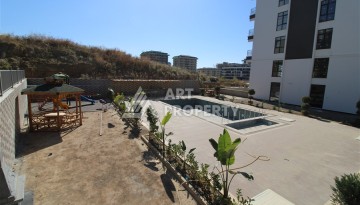 Две квартиры 1+1 в новом жилом комплексе Махмутлара, 47 кв.м. - Ракурс 10