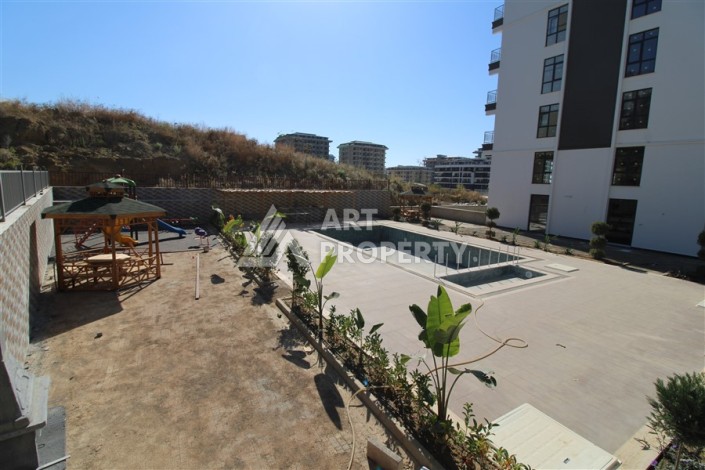 Две квартиры 1+1 в новом жилом комплексе Махмутлара, 47 кв.м. - Ракурс 9