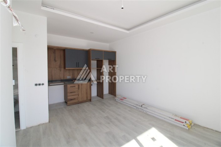 Две квартиры 1+1 в новом жилом комплексе Махмутлара, 47 кв.м. - Ракурс 13