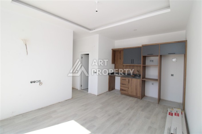 Две квартиры 1+1 в новом жилом комплексе Махмутлара, 47 кв.м. - Ракурс 14