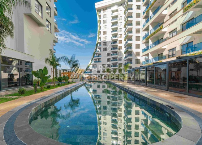 Квартира 1+1 с большим балконом в новом доме, 60 кв.м. Махмутлар, Алания - Ракурс 2