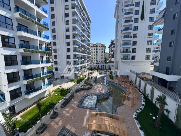 Квартира 1+1 с большим балконом в новом доме, 60 кв.м. Махмутлар, Алания - Ракурс 6