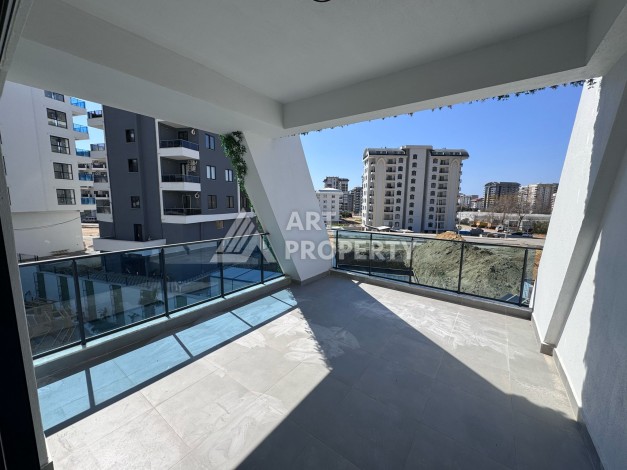 Квартира 1+1 с большим балконом в новом доме, 60 кв.м. Махмутлар, Алания - Ракурс 12