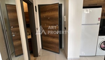 Стильная меблированная квартира 1+1 с видом на бассейн в элитной резиденции Махмутлара, 55 кв.м. - Ракурс 4