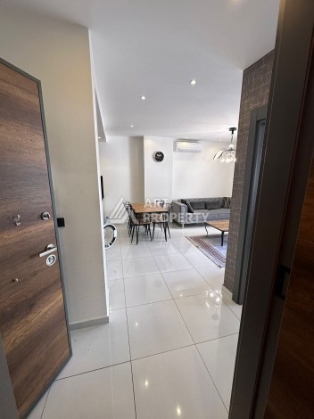 Стильная меблированная квартира 1+1 с видом на бассейн в элитной резиденции Махмутлара, 55 кв.м. - Ракурс 4