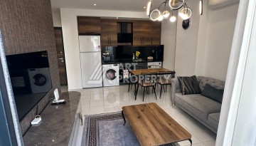 Стильная меблированная квартира 1+1 с видом на бассейн в элитной резиденции Махмутлара, 55 кв.м. - Ракурс 6