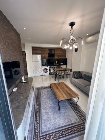 Стильная меблированная квартира 1+1 с видом на бассейн в элитной резиденции Махмутлара, 55 кв.м. - Ракурс 5