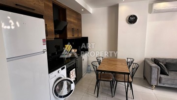 Стильная меблированная квартира 1+1 с видом на бассейн в элитной резиденции Махмутлара, 55 кв.м. - Ракурс 7