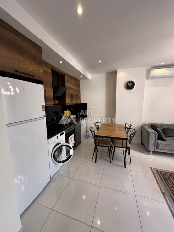 Стильная меблированная квартира 1+1 с видом на бассейн в элитной резиденции Махмутлара, 55 кв.м. - Ракурс 6