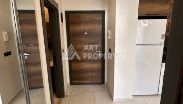 Стильная меблированная квартира 1+1 с видом на бассейн в элитной резиденции Махмутлара, 55 кв.м. - Ракурс 9