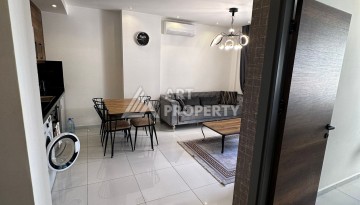 Стильная меблированная квартира 1+1 с видом на бассейн в элитной резиденции Махмутлара, 55 кв.м. - Ракурс 11