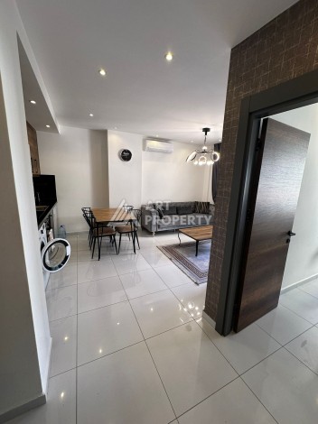 Стильная меблированная квартира 1+1 с видом на бассейн в элитной резиденции Махмутлара, 55 кв.м. - Ракурс 10