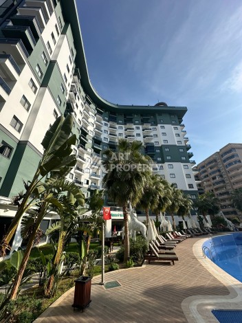 Стильная меблированная квартира 1+1 с видом на бассейн в элитной резиденции Махмутлара, 55 кв.м. - Ракурс 16