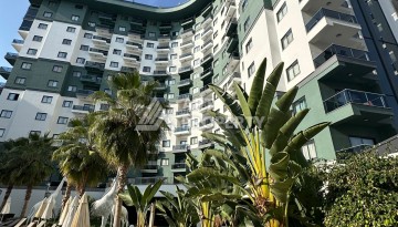 Стильная меблированная квартира 1+1 с видом на бассейн в элитной резиденции Махмутлара, 55 кв.м. - Ракурс 18