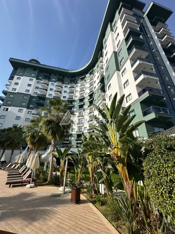 Стильная меблированная квартира 1+1 с видом на бассейн в элитной резиденции Махмутлара, 55 кв.м. - Ракурс 17