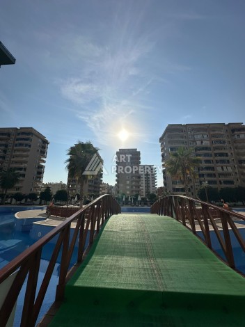 Стильная меблированная квартира 1+1 с видом на бассейн в элитной резиденции Махмутлара, 55 кв.м. - Ракурс 18