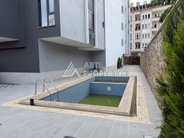 Кварти ра 1+1 в новом доме, 55 кв.м. Махмутлар, Алания. - Ракурс 14