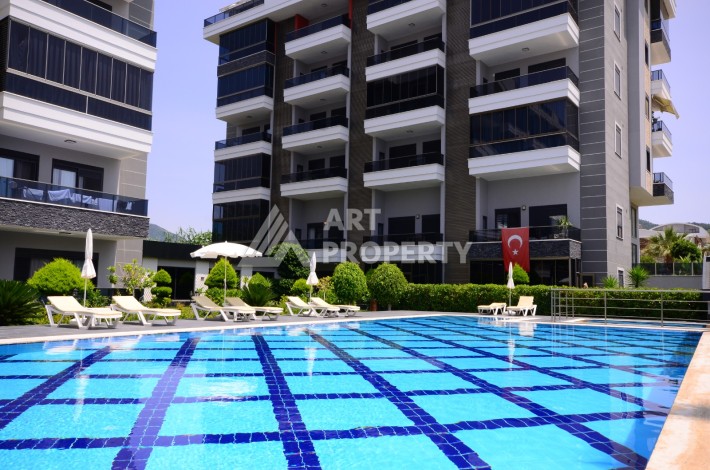 Двухуровневая квартира 2+1 с выходом в сад, 300 метров до моря в районе Каргыджак - Ракурс 0