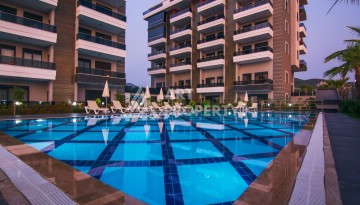 Двухуровневая квартира 2+1 с выходом в сад, 300 метров до моря в районе Каргыджак - Ракурс 2