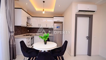 Двухуровневая квартира 2+1 с выходом в сад, 300 метров до моря в районе Каргыджак - Ракурс 6