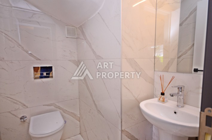 Двухуровневая квартира 2+1 с выходом в сад, 300 метров до моря в районе Каргыджак - Ракурс 7