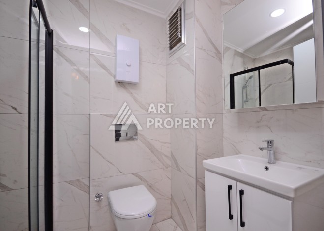 Двухуровневая квартира 2+1 с выходом в сад, 300 метров до моря в районе Каргыджак - Ракурс 14