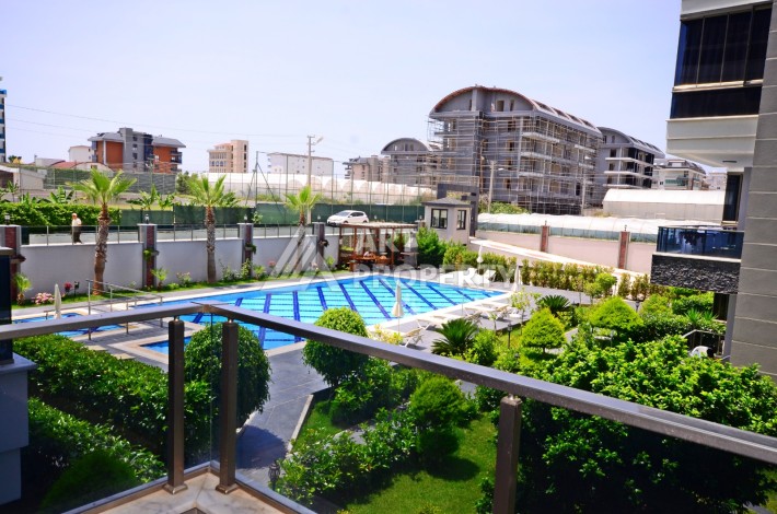 Двухуровневая квартира 2+1 с выходом в сад, 300 метров до моря в районе Каргыджак - Ракурс 26