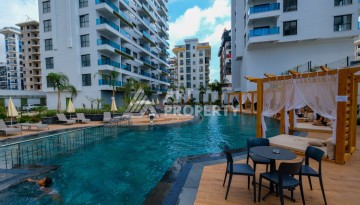 Квартира 1+1, 55 м² в центре Махмутлара. Стильная новая резиденция. - Ракурс 1