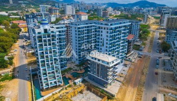 Квартира 1+1, 55 м² в центре Махмутлара. Стильная новая резиденция. - Ракурс 9