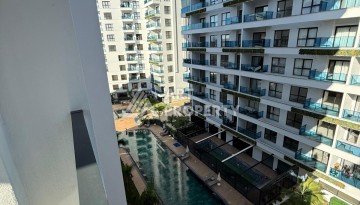 Квартира 1+1, 55 м² в центре Махмутлара. Стильная новая резиденция. - Ракурс 24